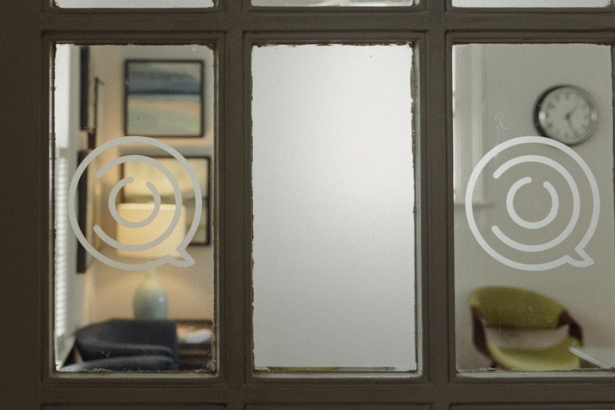 Frosted glass door with the Jill Smith & Associates logo, looking into a counseling office