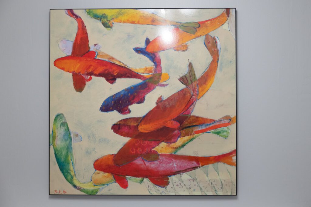 Colorful koi painting on a Lexington office wall