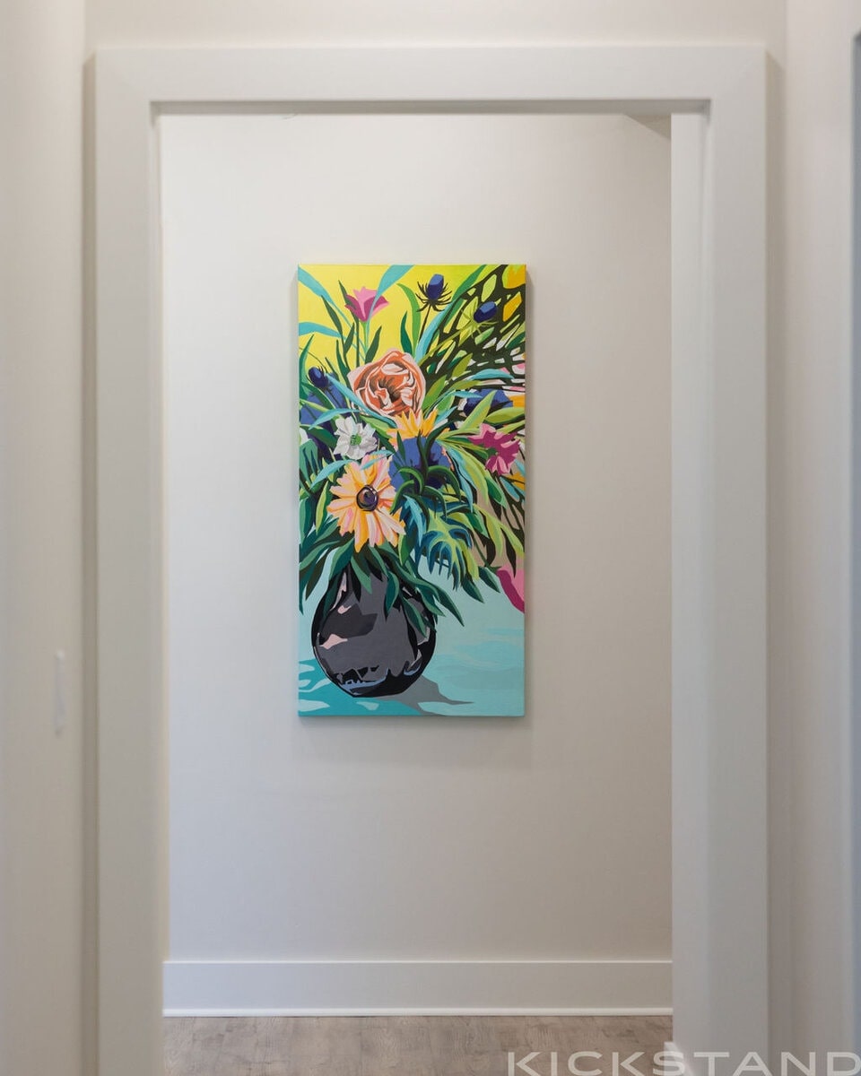 Colorful floral painting in a doorway at the Columbia office