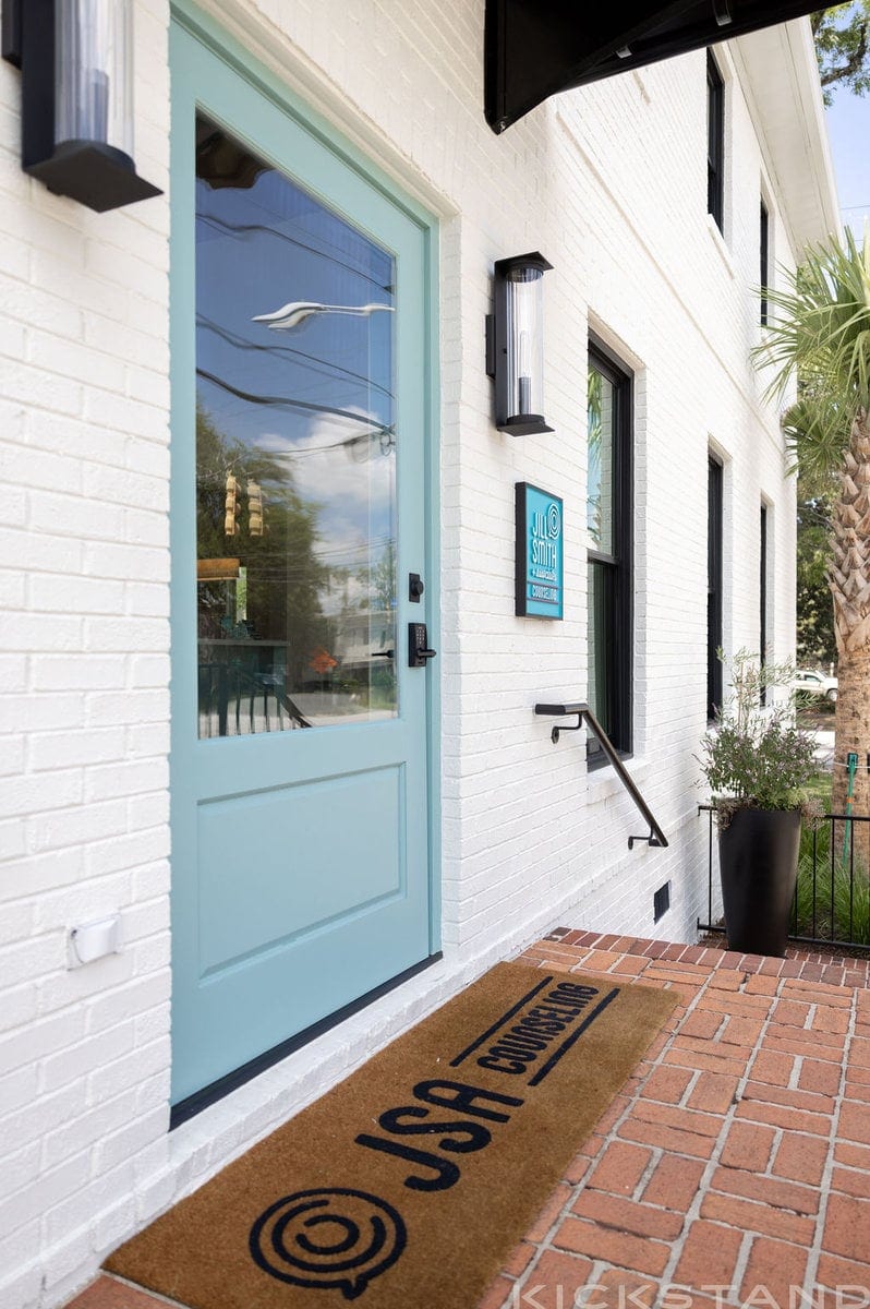 Teal front door and JSA Counseling doormat at the Downtown Columbia office
