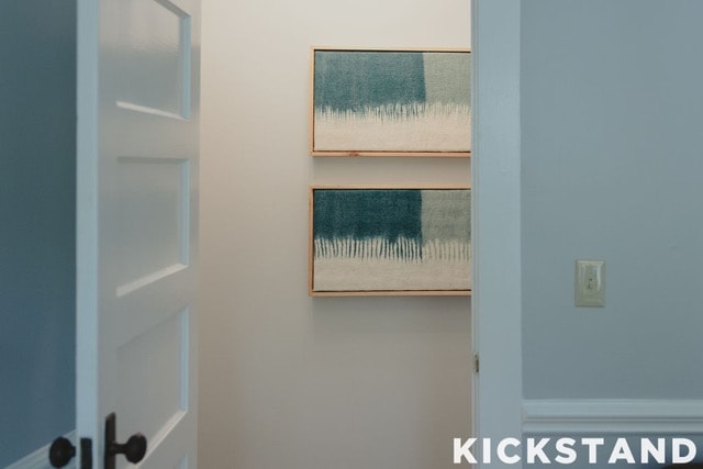 Two teal woven artworks in a Lexington office hallway