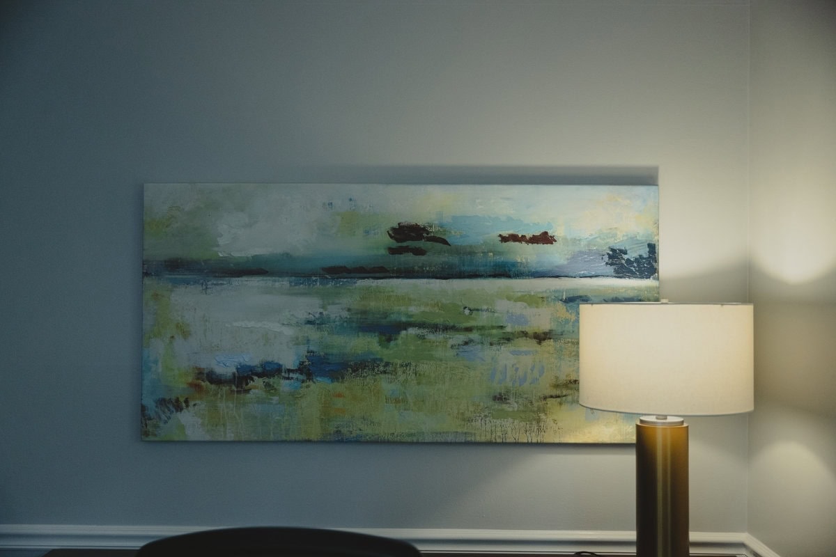 Landscape painting and brass lamp in a Lexington counseling room